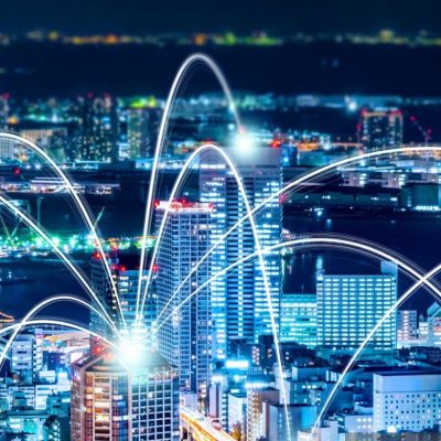 Business concept for information, communication , connection technology - panoramic modern city skyline, bird eye aerial night view under beautiful dark blue night sky in Roppongi Hill, Tokyo, Japan.